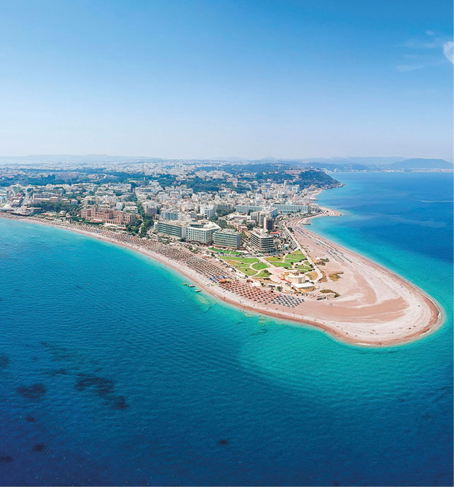 Aerial view of a beach on the corner stretch of an island