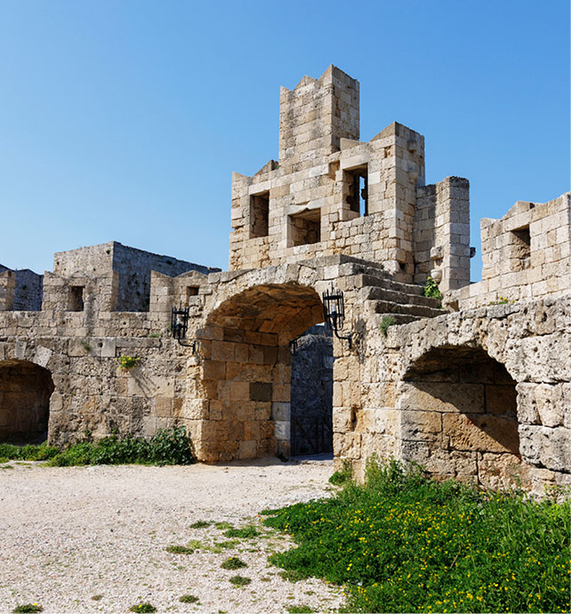 Limestone building next to a stone path