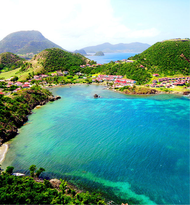 Clear blue waters, lush green landscapes, and colourful settlements in Terre de Haut, Guadeloupe