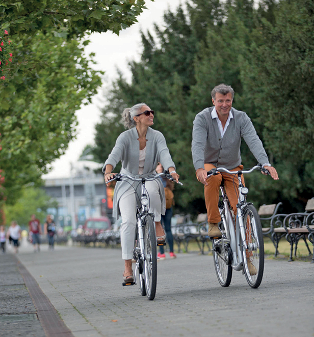 A couple riding bikes in Europe