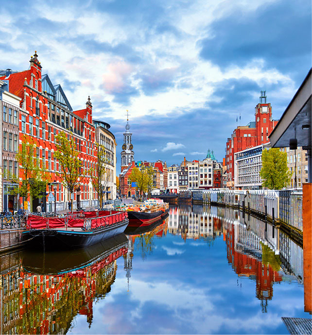 Bright and colourful houses along a canal in Amsterdam, Netherlands