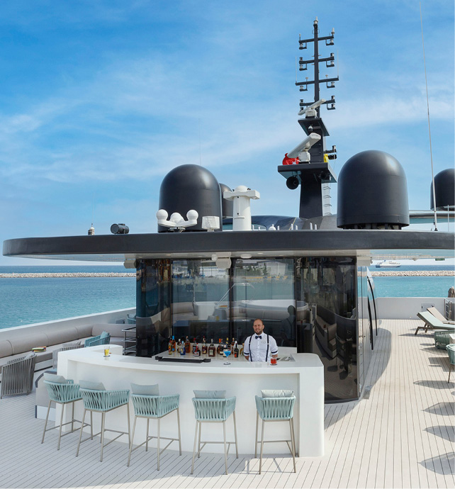 Spacious open deck, the Sky Deck, on an Emerald Cruises yacht cruise fitted with bar and comfortable seating